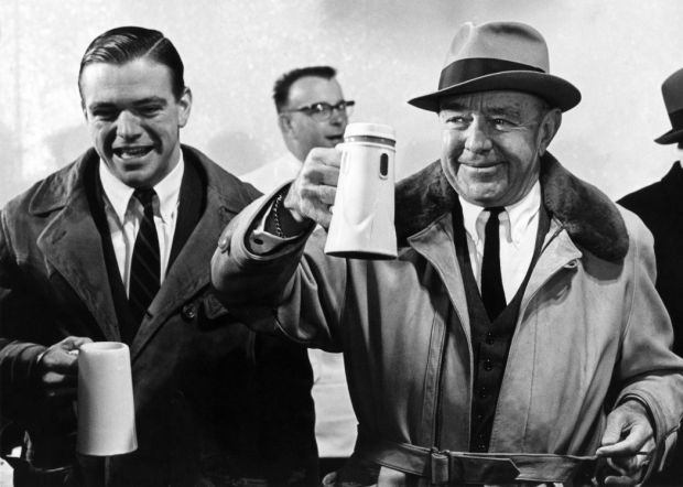 August A. Busch Jr. and son toast a beer, 1964